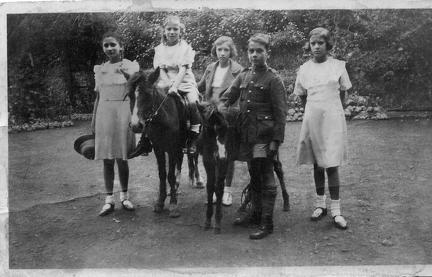 Five children with two ponies