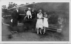 Cartner family next to a car