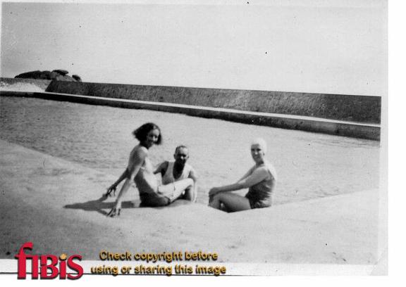 two ladies and a man swimming