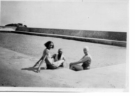 two ladies and a man swimming