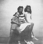 Unknown woman and two children