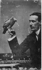 Man holding a parrot